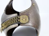 a close up of a helmet on a white surface