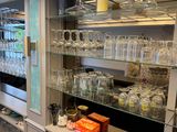many glasses on the shelves in the kitchen