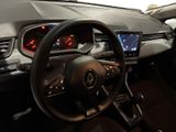 steering wheel and dashboard of a car on display in a showroom