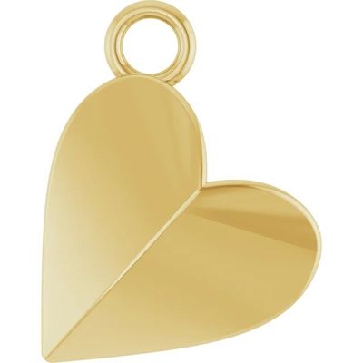 un gros plan d'un pendentif en forme de cœur doré sur fond blanc