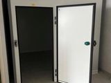 a room with a white door and a black and white door