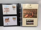 an open binder with a picture of a deer and other animals on it