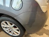a close up of a car ' s tire with a sticker on it