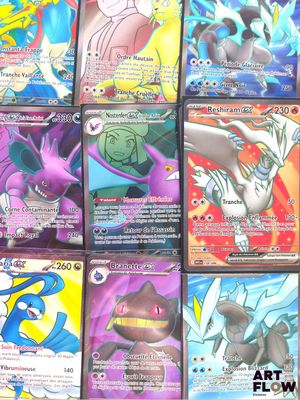 pokemon cards are lined up in a row on a table