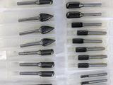 many different tools in a plastic container