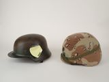 two helmets are sitting next to each other on a white surface
