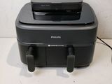 the printer is sitting on top of the table next to the mouse