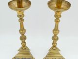 pair of antique brass candlesticks with green glass top