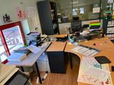 a desk with a computer and a monitor on it