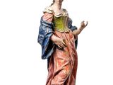 statue of a woman in a pink dress with a blue shawl and a green shawl
