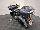 a motorcycle that is parked on a checkered floor
