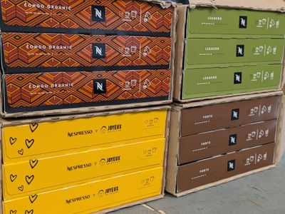 several boxes are stacked on top of each other on a sidewalk