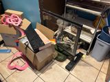 a keyboard and a mouse in a box on the floor