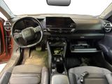 the interior of a car with a steering wheel and dashboard