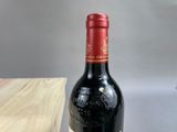 a bottle of wine that is sitting on a table