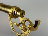 a close up of a brass sexet on a white background
