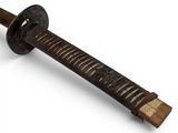 a close up of a sword with a wooden handle on a white background