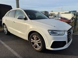 the white audi suv is parked in the parking lot
