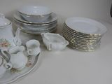a lot of dishes and cups on the table
