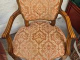 a chair that is next to a chair that is sitting on the floor