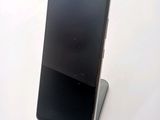a cell phone that is sitting on top of a stand
