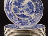 six blue and white plates stacked on top of each other