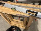 a ruler that is sitting on top of a wooden table