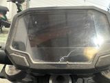 a close up of a motorcycle ' s windshield and handlebars