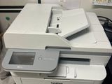 a printer that is sitting on top of a desk