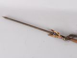 a small wooden stick with a feather on top of it