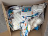 a cardboard box full of toilet paper and other items
