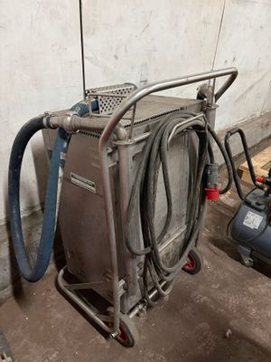 a machine that is sitting next to a air compressor