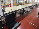 a laptop computer sitting on a table in a factory