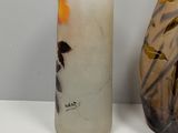 two vases sitting next to each other on a table