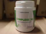 a bottle of complex 3g sitting on a table