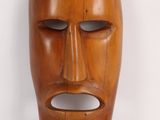 an image of a wooden mask on a white background