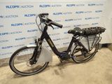 a bike that is parked in front of a wall