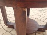 a wooden table that has a glass top on it