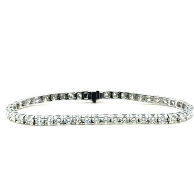 a diamond tennis bracelet on a white background