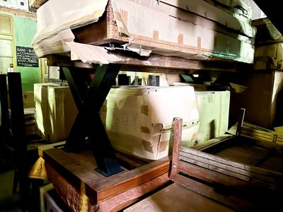 a stack of boxes sitting on top of a wooden table