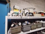 a shelf full of electronics and other items in a room