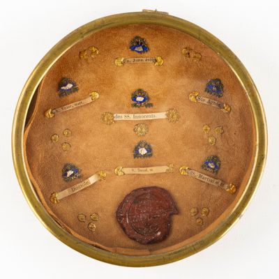 a picture of a gold case with a coin inside of it