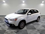a picture of a white suv parked on a checkered floor
