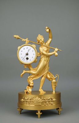 an image of a gold clock with a woman holding a sword