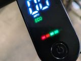 a digital clock on the handlebar of a bicycle