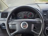 dashboard of a car with a steering wheel and dashboard gauges