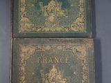 pair of antique books of france and france on a blue background