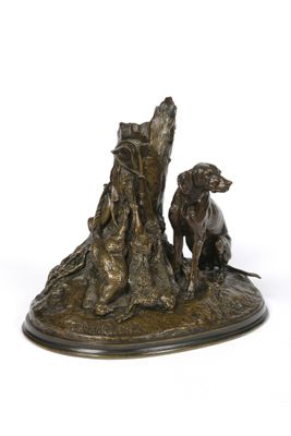 bronze statue of a dog and a cat sitting on a tree stump