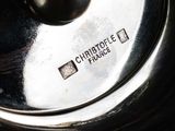a close up of a silver pot with a lid