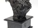 an image of a sculpture of a hawk on a black base